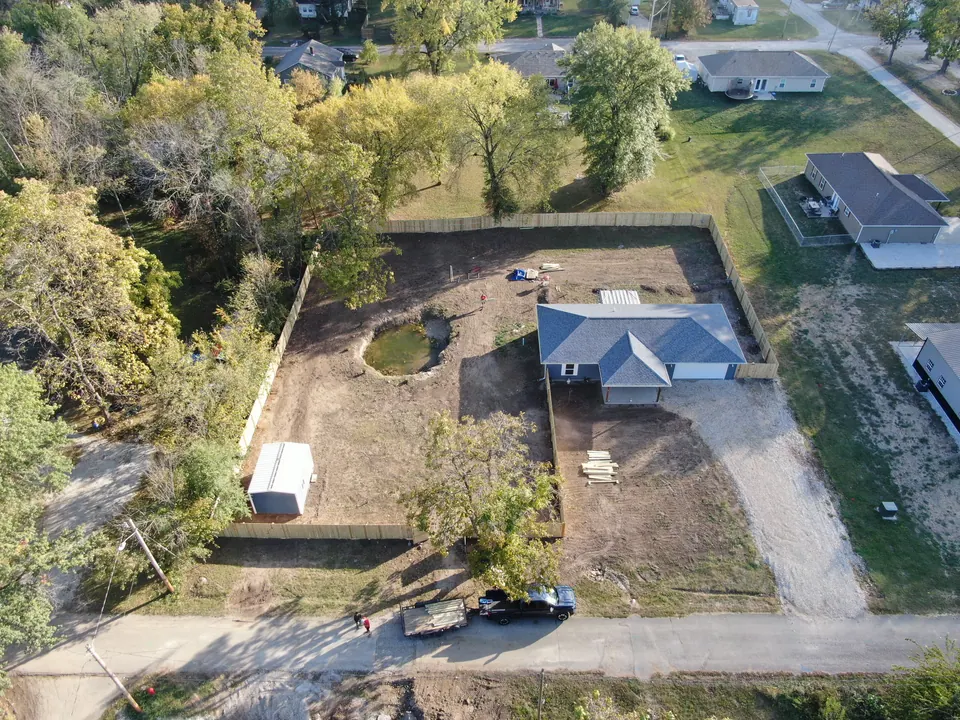 Aerial view of a new wood privacy fence enclosing a large backyard
