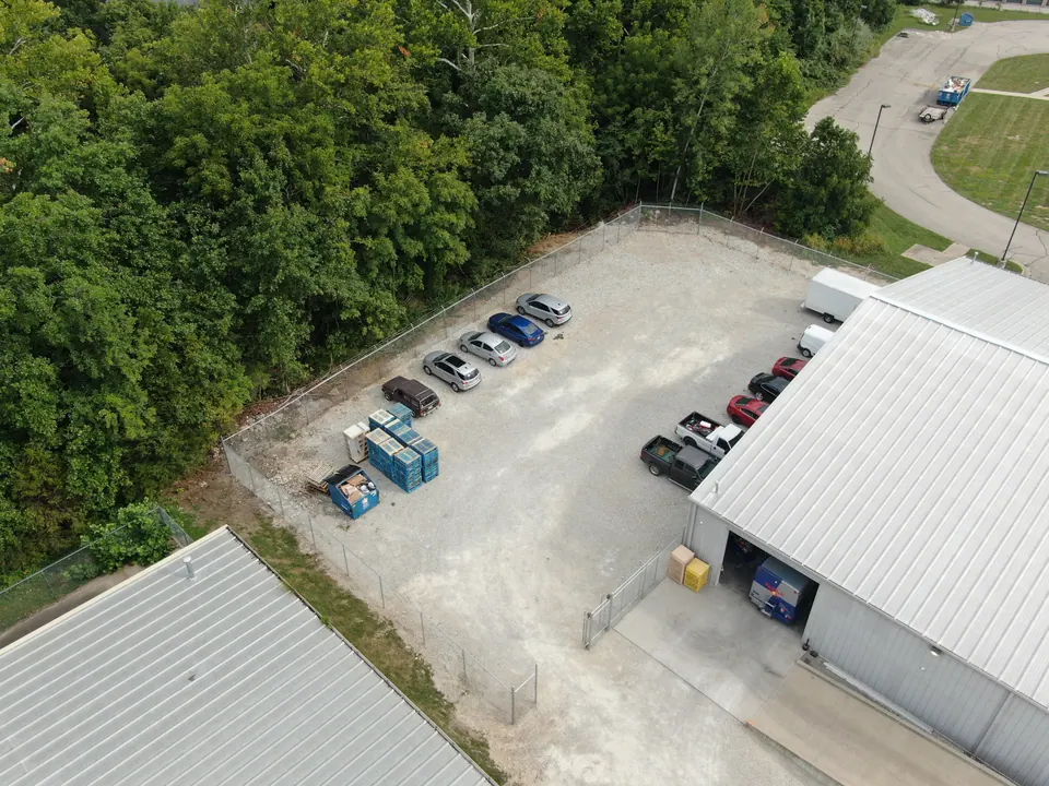 Aerial view of chain link fencing around a commercial parking lot