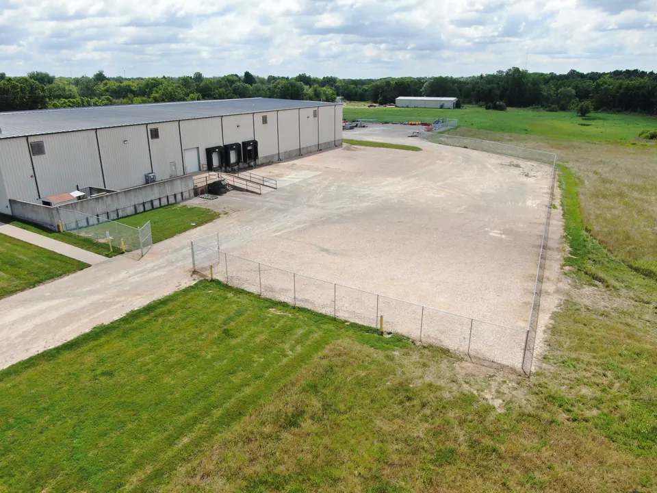 Chain link fence around the yard of a commercial warehouse